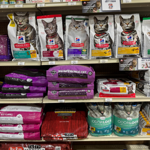 Pet food and supplies on display inside of McGregor General store.