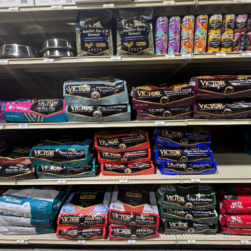 Pet food and supplies on display inside of McGregor General store.